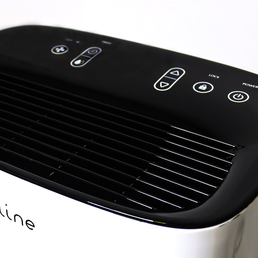 Dehumidifier top control panel with touch buttons and power indicator