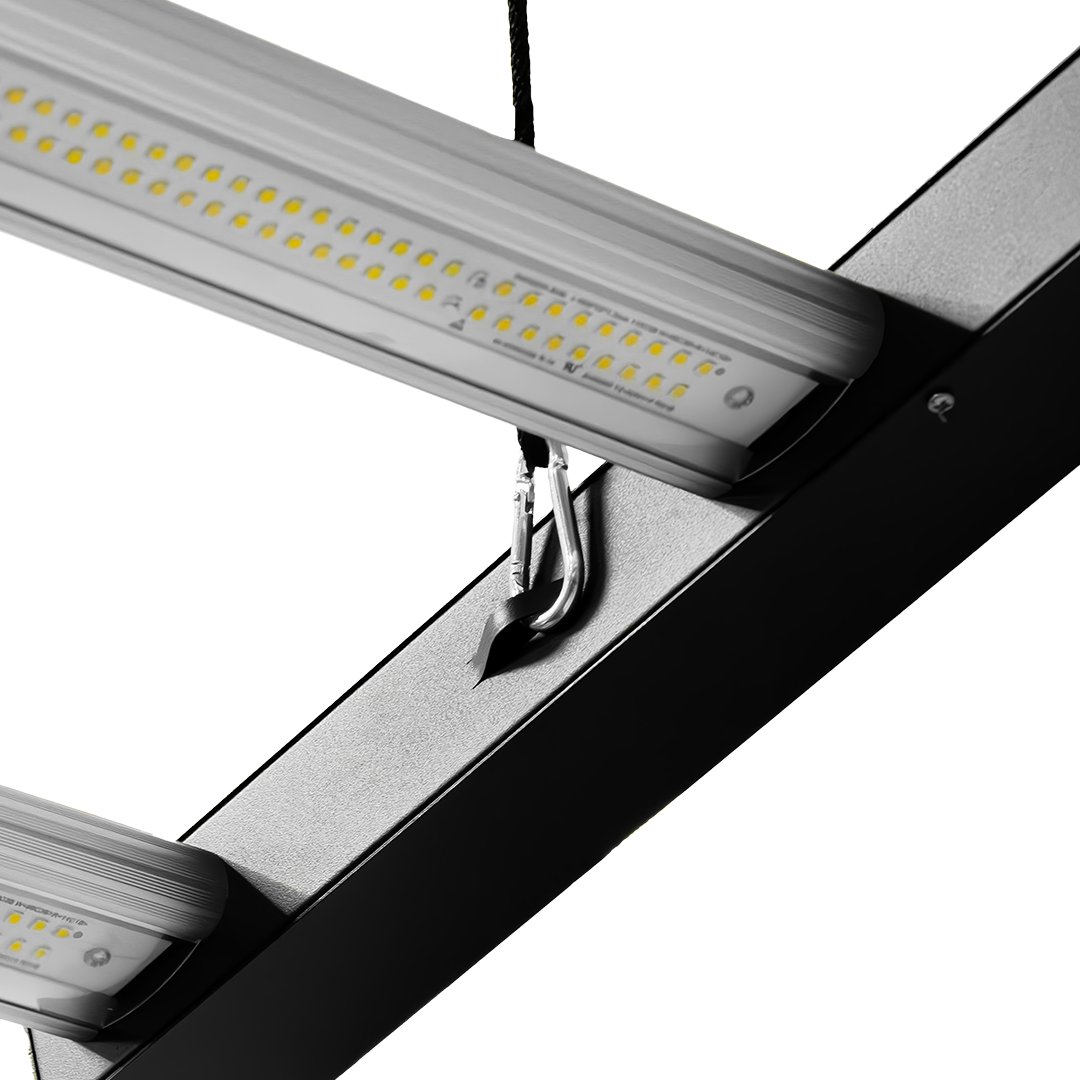 LED light bar with row of yellow LEDs and silver reflector under black frame edge