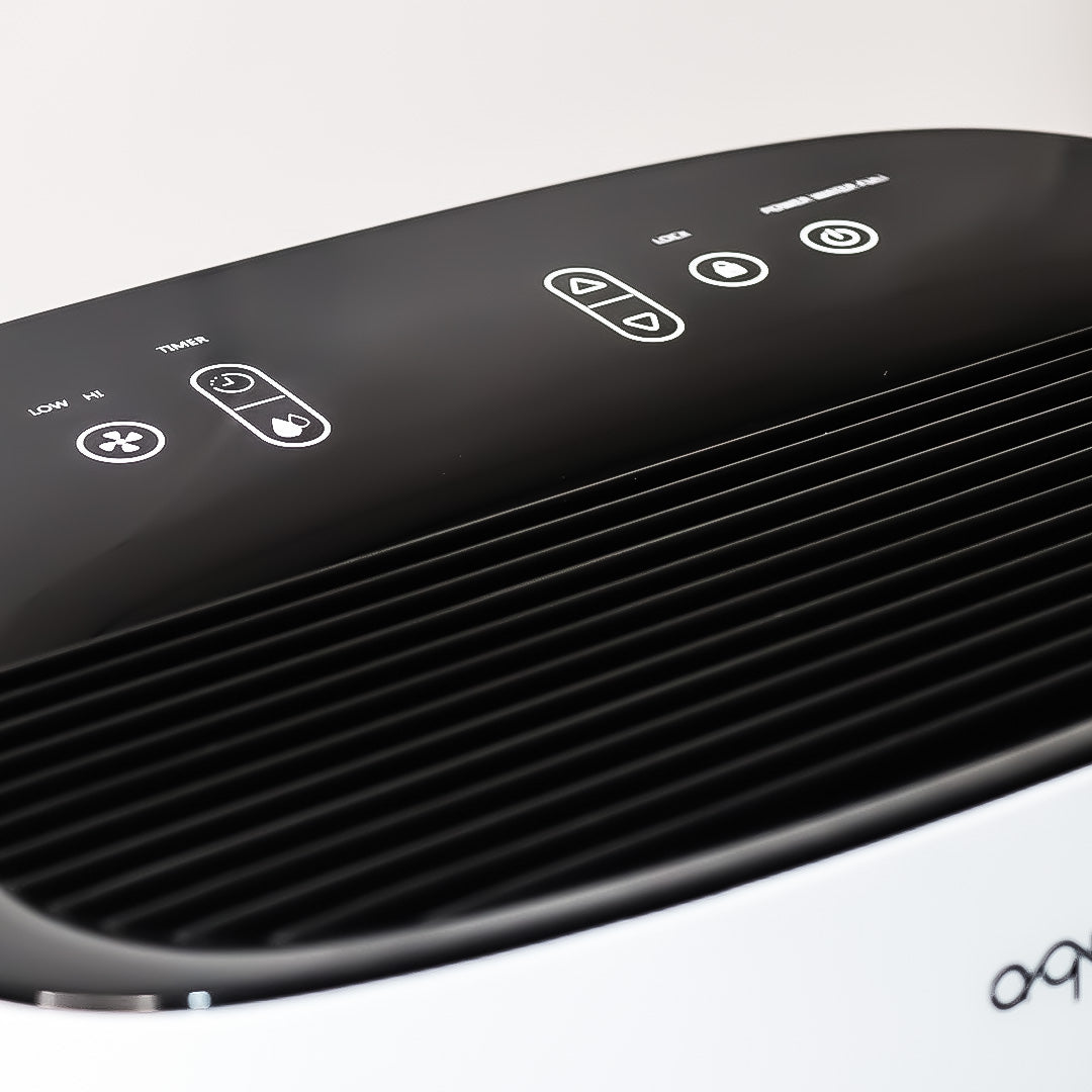 Dehumidifier top control panel with icon buttons on dark cover
