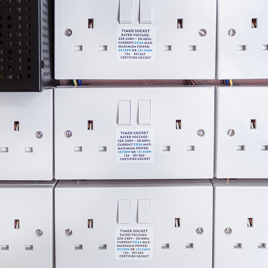 White contactor modules labeled timed socket with indicator switches
