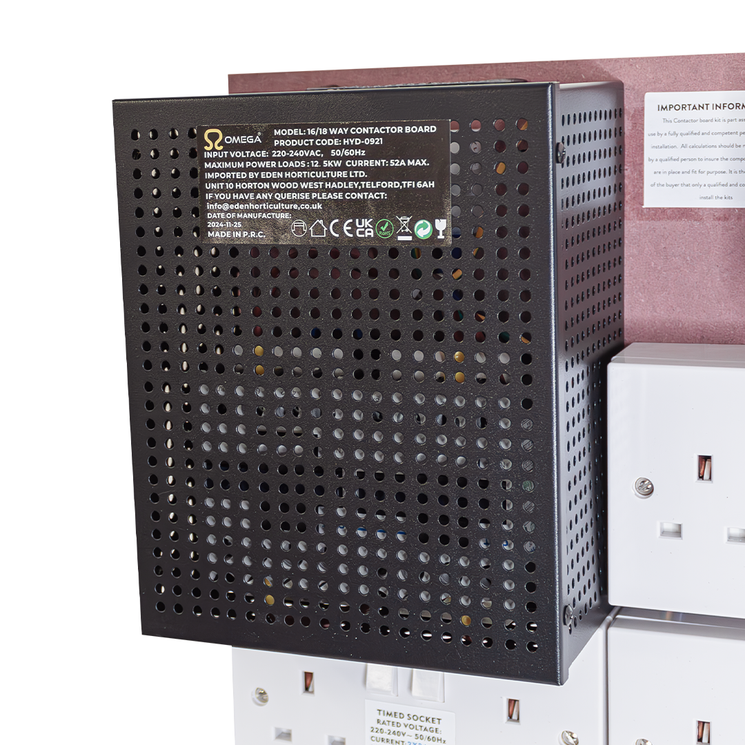 Dark perforated back panel of the contactor board with label and terminals