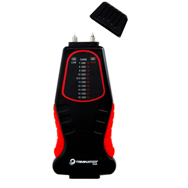 Triminator moisture meter with black/red display and needle probes, slide cap on top