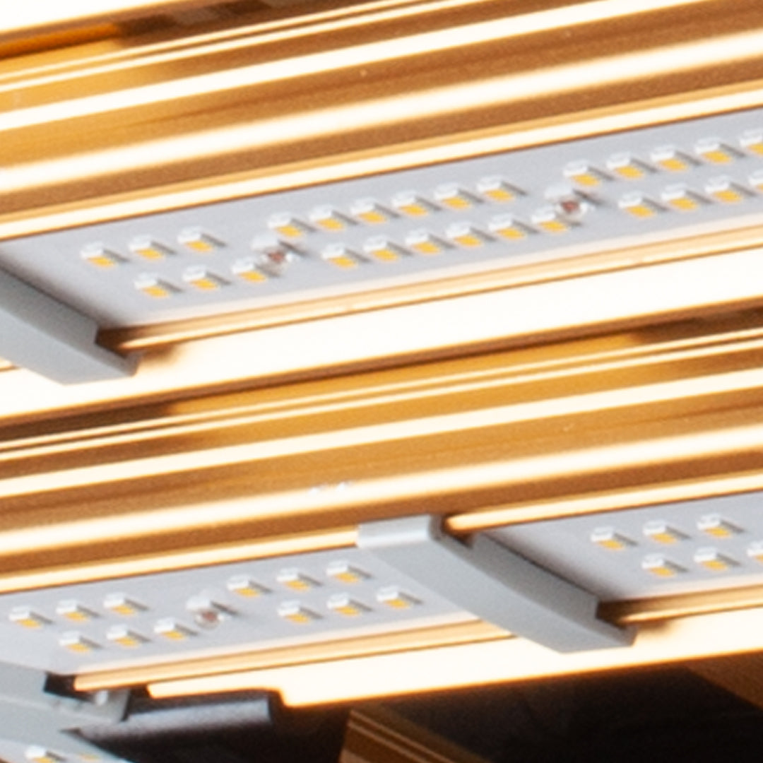 LED grow light panels with rows of white LEDs on a metallic, brown frame