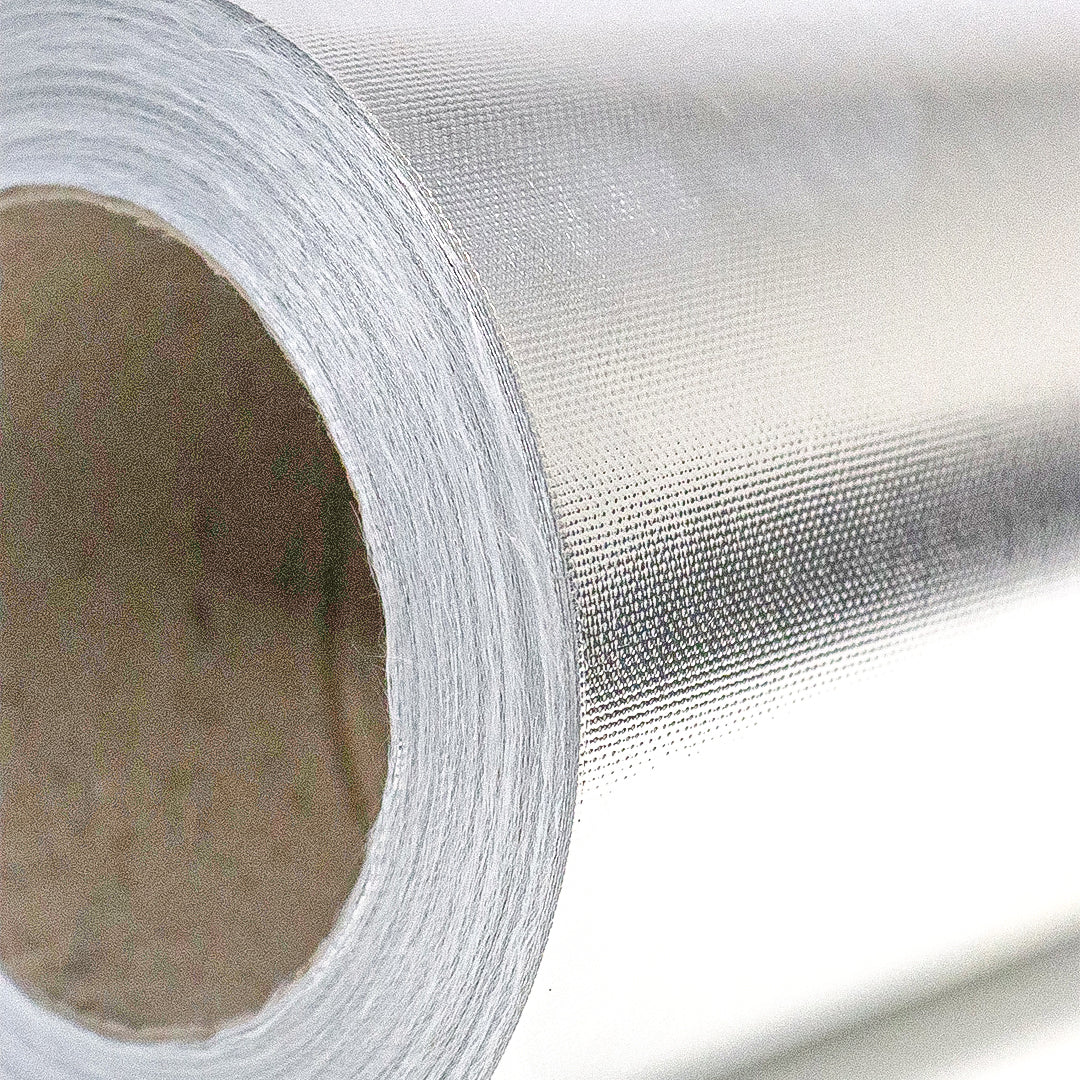 Thermal reflection sheeting close-up, metallic woven foil surface and inner roll core
