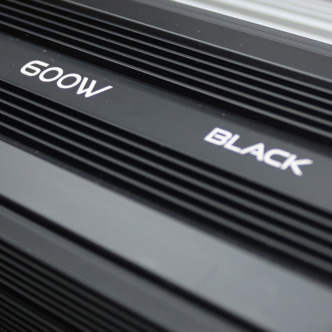 Black LED grow light bar housing with printed “BLACK” text on matte metal.