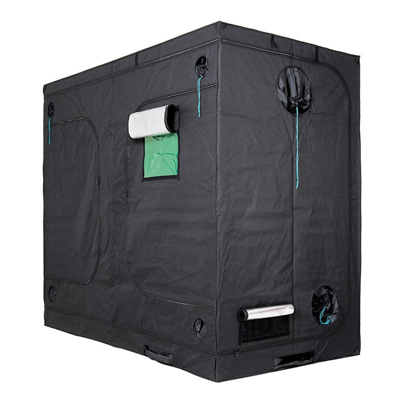 Grow tent corner view with green window panel and circular fan outlet on roof