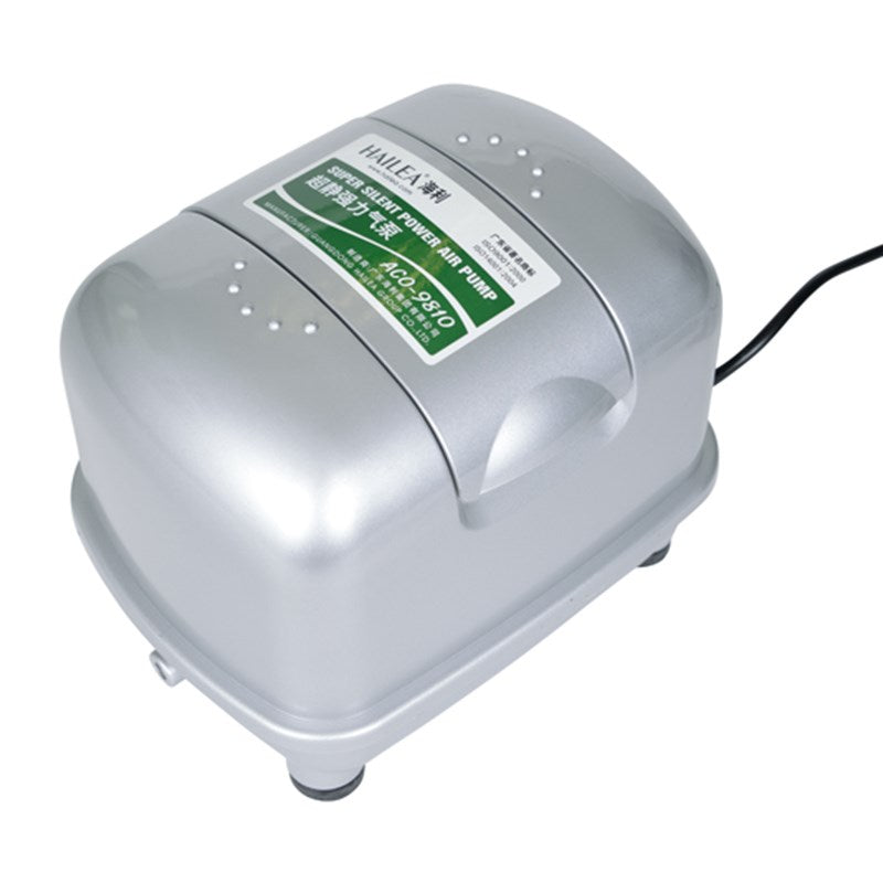 Silver air pump with green specification label and power cord, rounded smooth casing