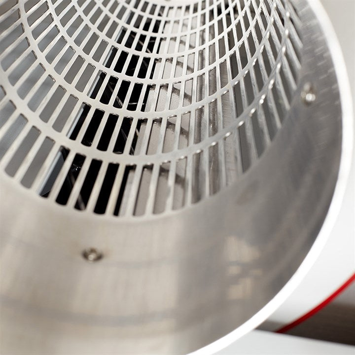 Rotating drum inside trimmer machine with metal grill and circular interior