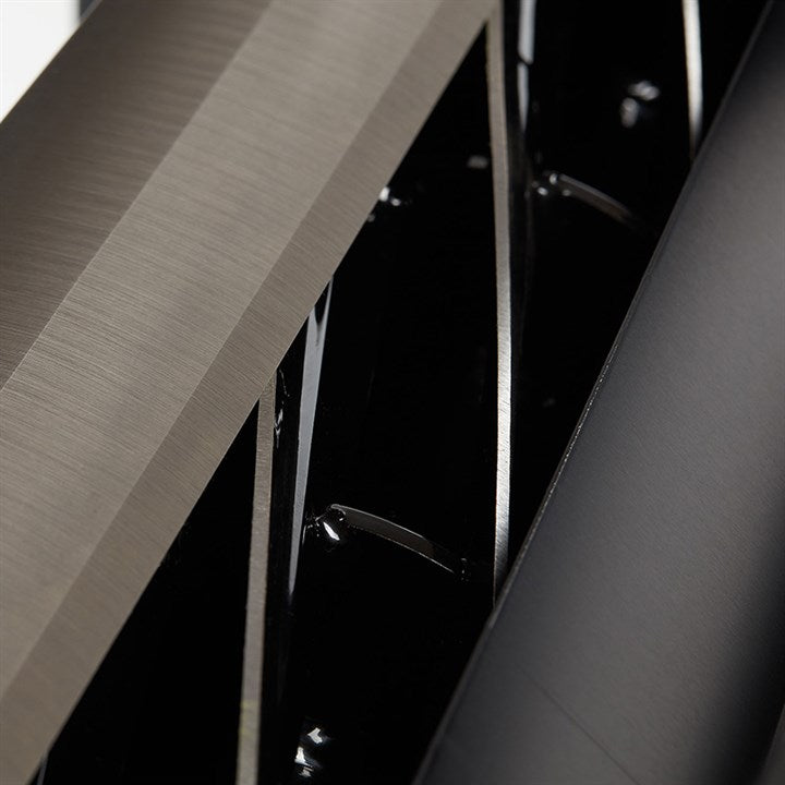 Electropolished trimmer housing with brushed metal panel and dark interior opening
