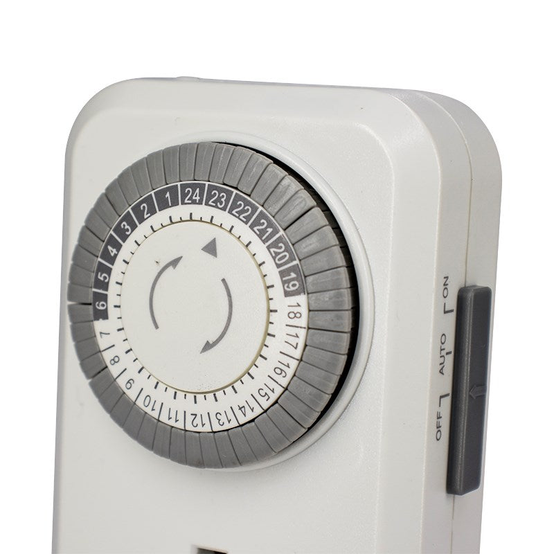 White 24-hour timer plug close-up with gray rotary time dial and ON/AUTO/OFF switch
