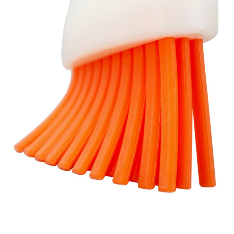 Bristle brush head with orange ridged tips and white base