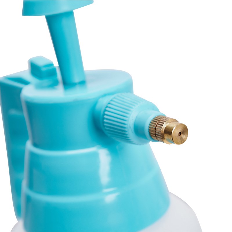 Close-up of turquoise pump outlet with ribbed knob and brass connector