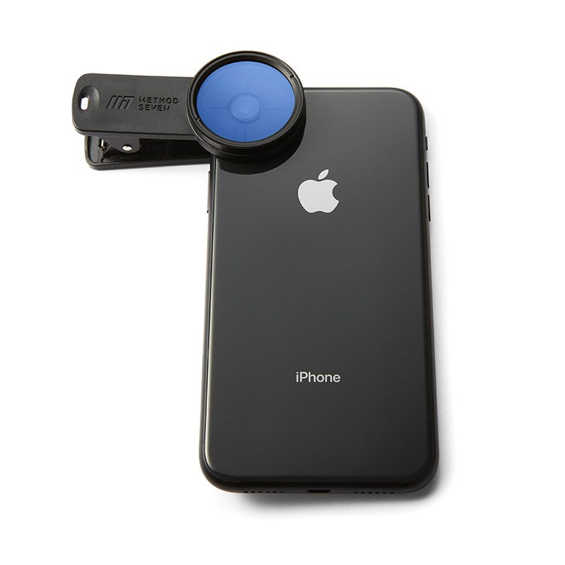 Phone camera lens filter clipped to iPhone, blue front lens filter
