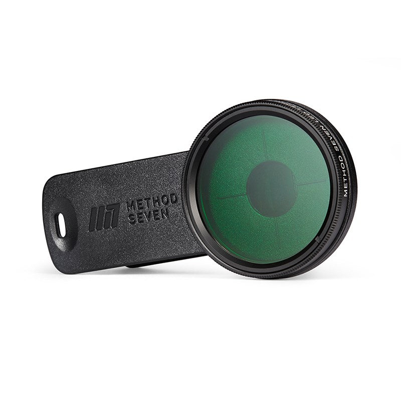 Phone camera lens filter with dark mount, green circular filter glass