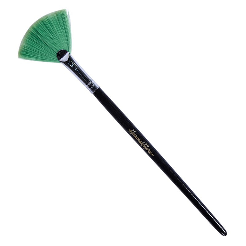 Static trim brush with black handle and green fan bristles