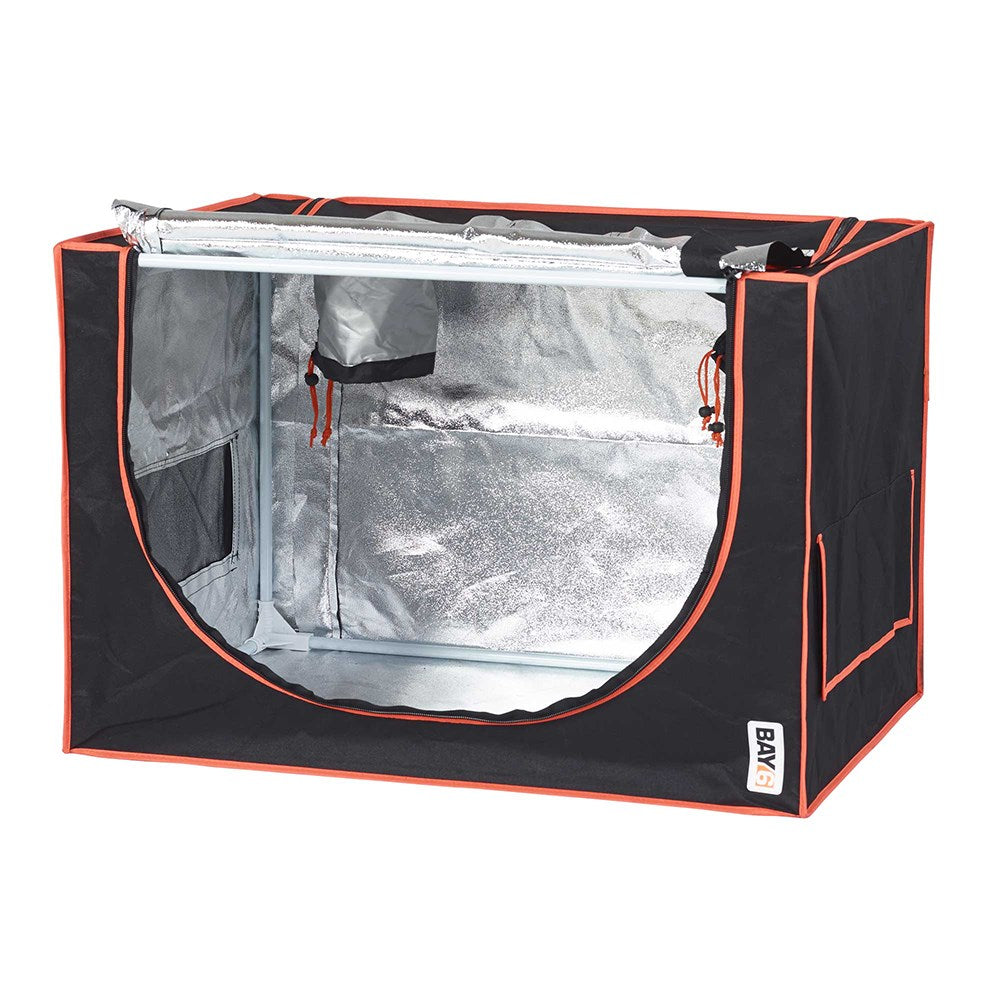 Grow tent with black fabric and orange trim; open front shows silver reflective interior
